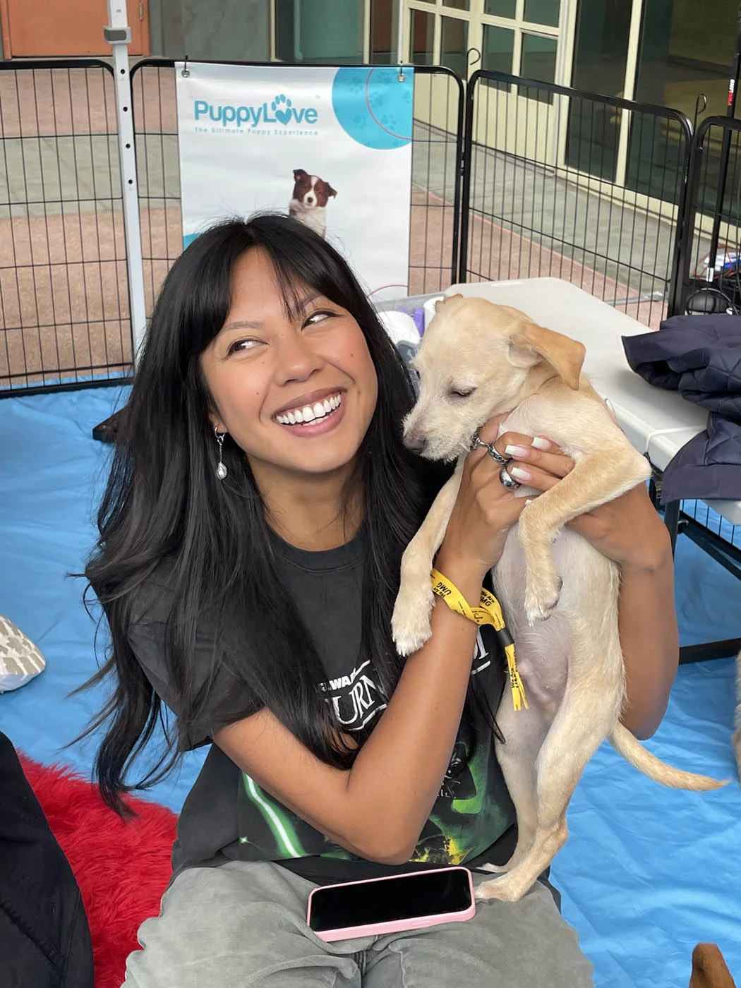 Adorable people holding adorable puppies with puppy love™.