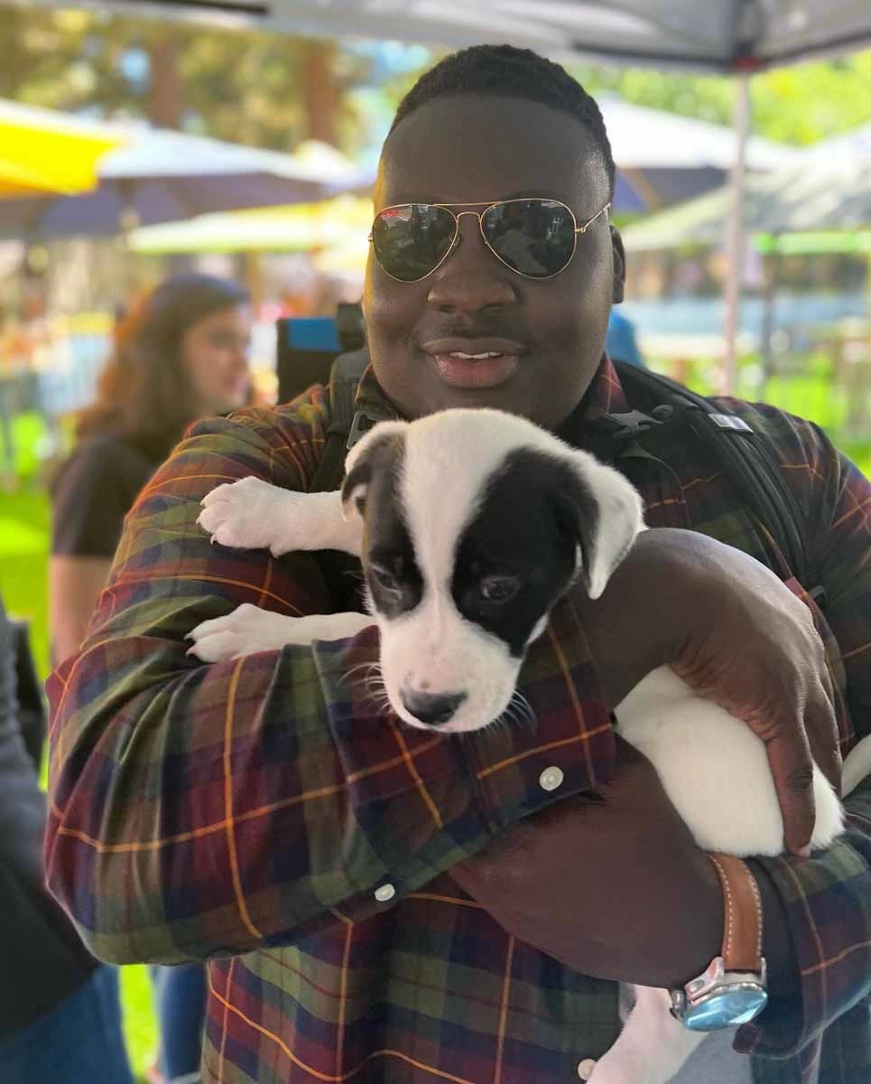 Ebay employee enjoying all the love they are recieving from a puppy love™ puppy.