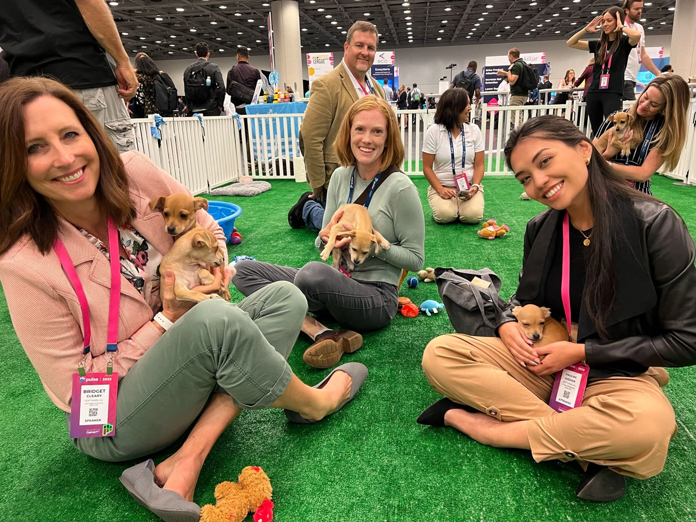 Man with a cute puppy at an out of the box wellness experience with puppy love™.