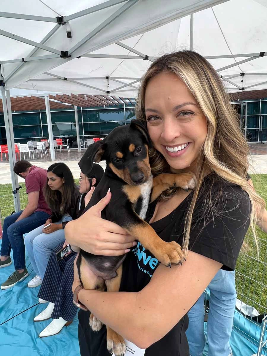 This sweet puppy and employee both love puppy love™'s corporate wellness companies!