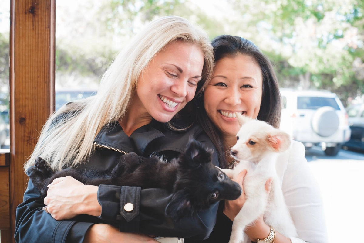 Women holding puppy