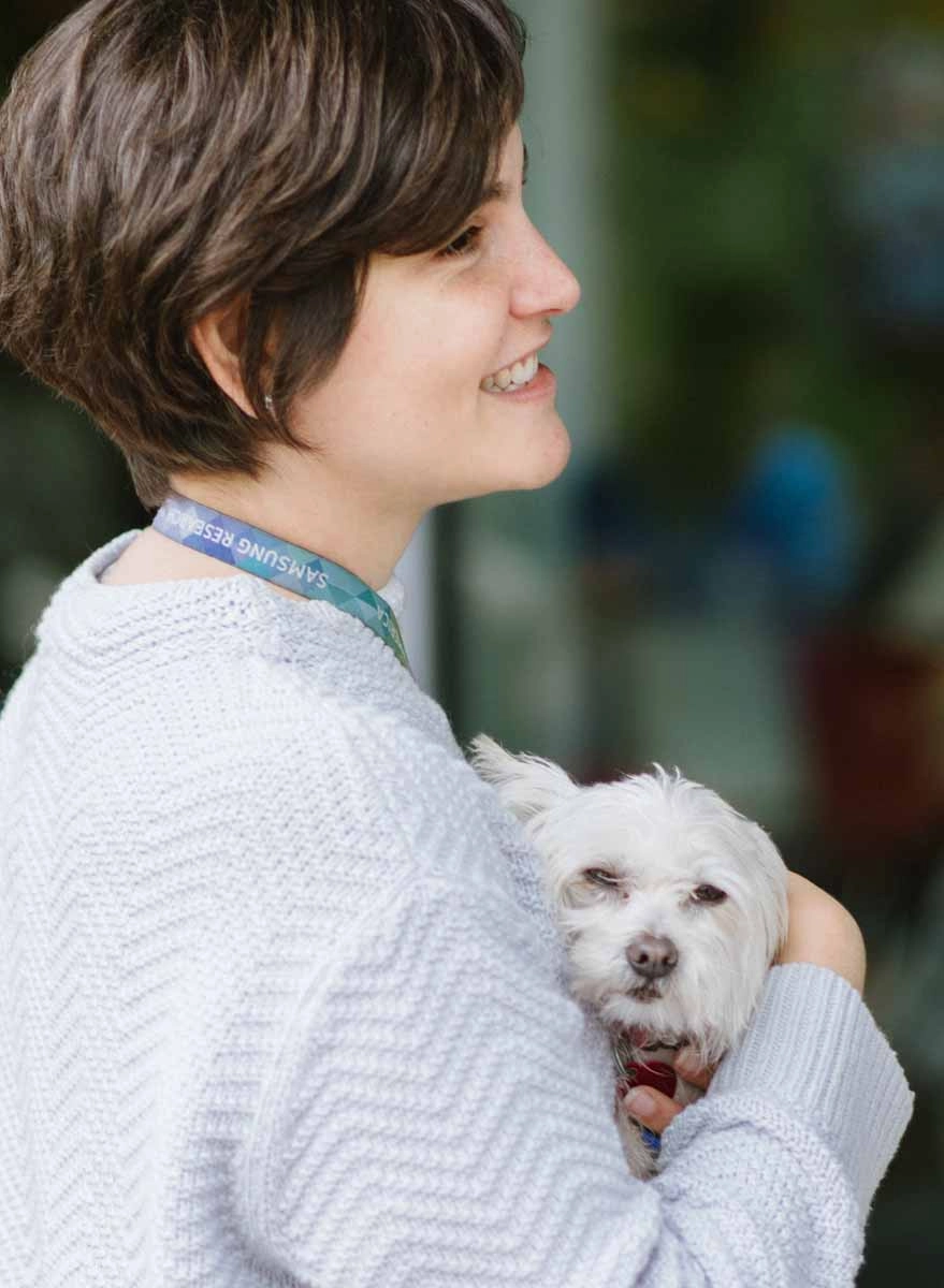 Ebay employee enjoying a corporate wellness experinece with a puppy.