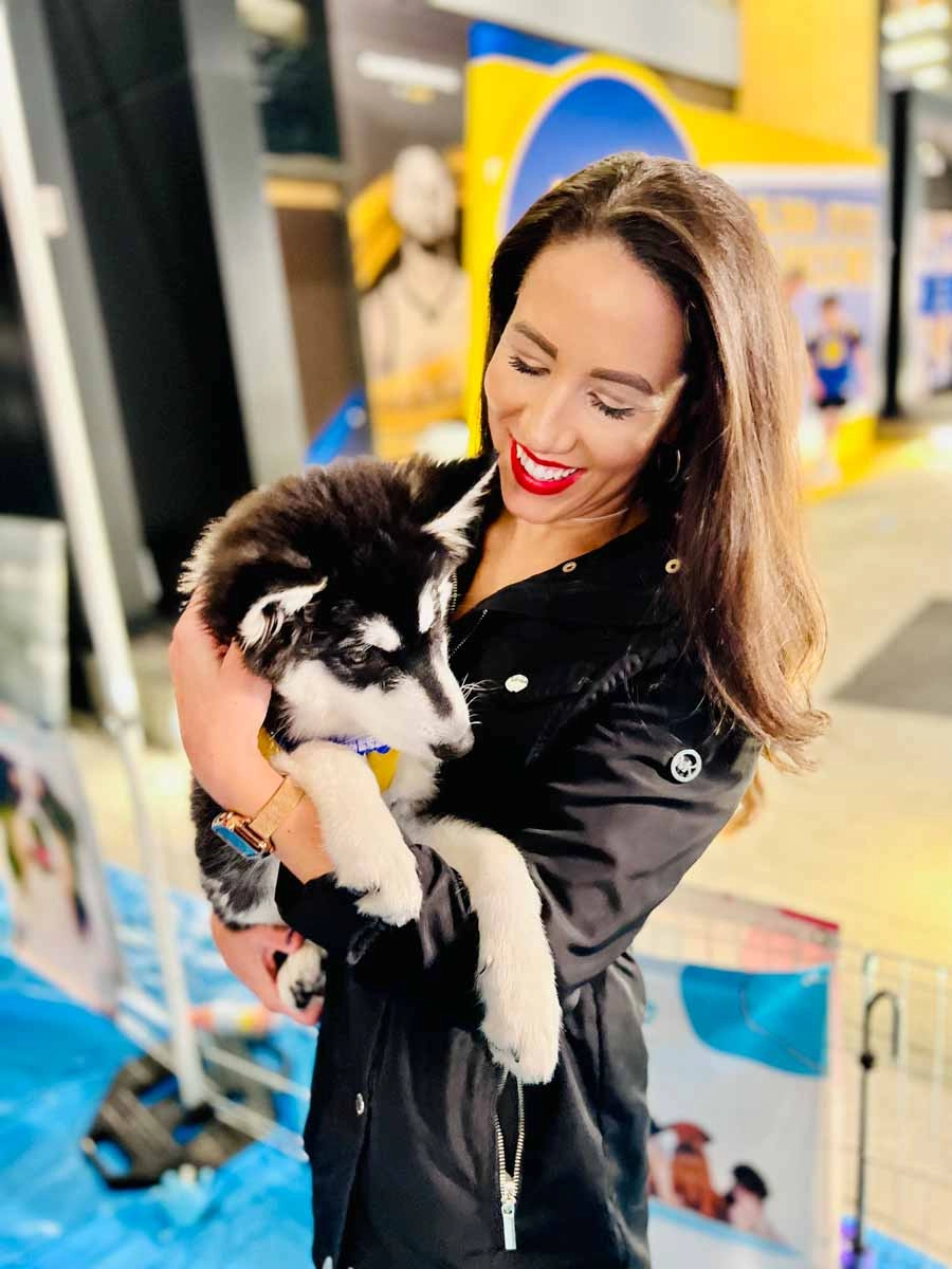 Warriors fan attending the activities at the community sports and wellness center with puppy love™'s special event.