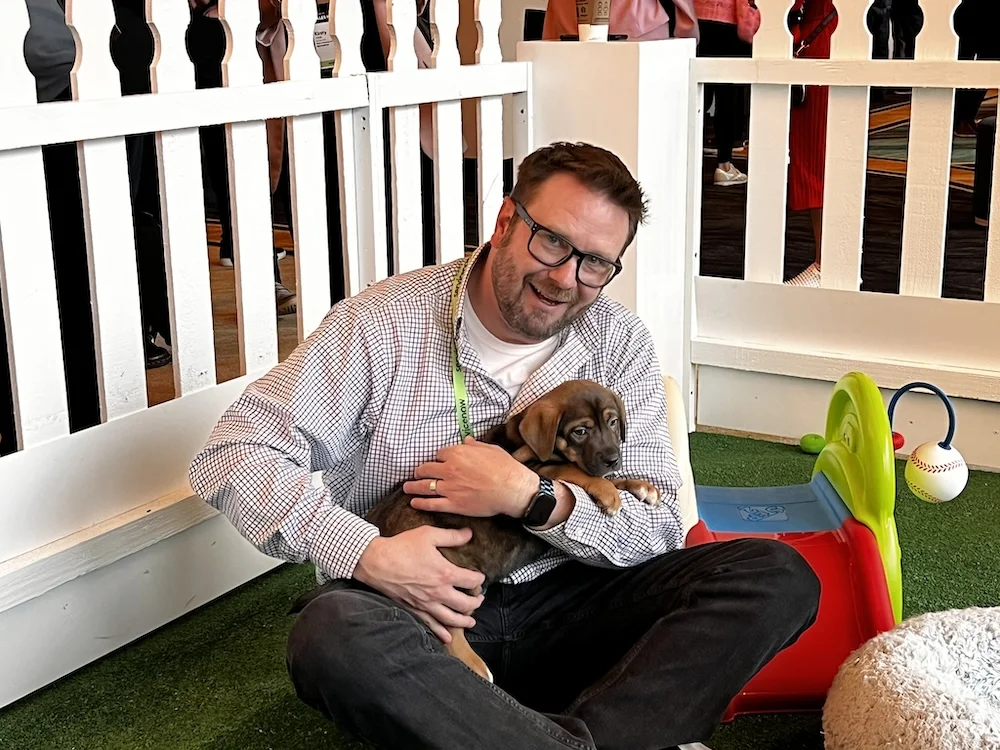 Man holding puppy
